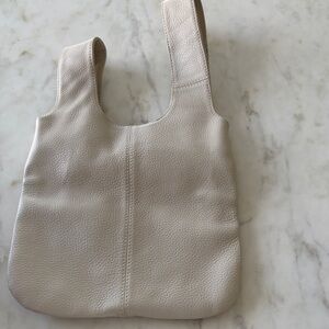 Bone pebble grain genuine leather small hand bag 10” x 17”. Lined. No wear.